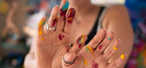 Painted fingers of an artist